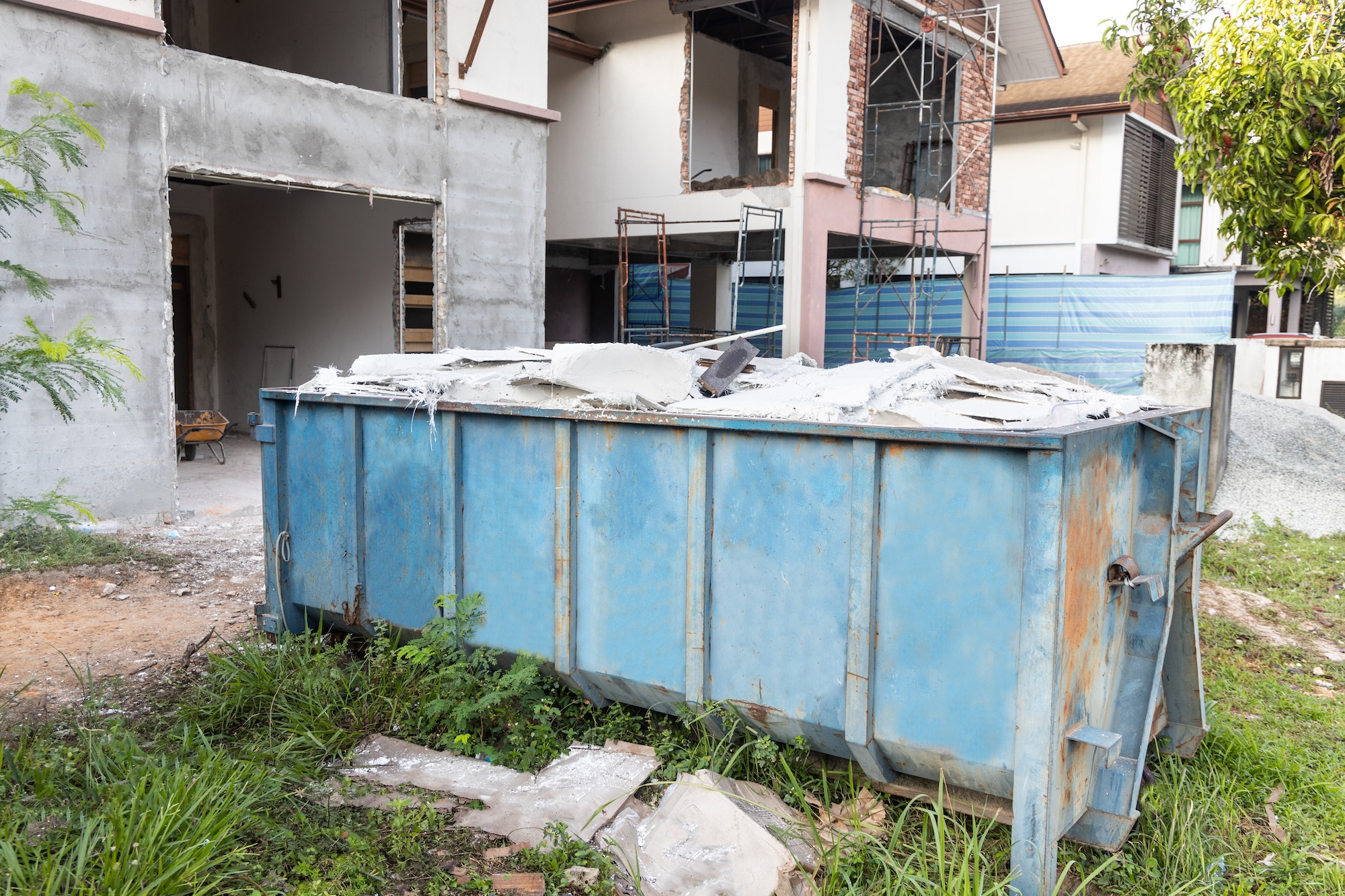 Garbage roro dumpter bin collects rubbish at construction site